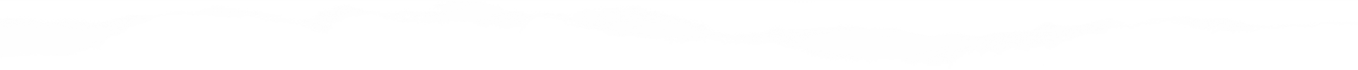 Silhouette of a jagged mountain range against a white background.