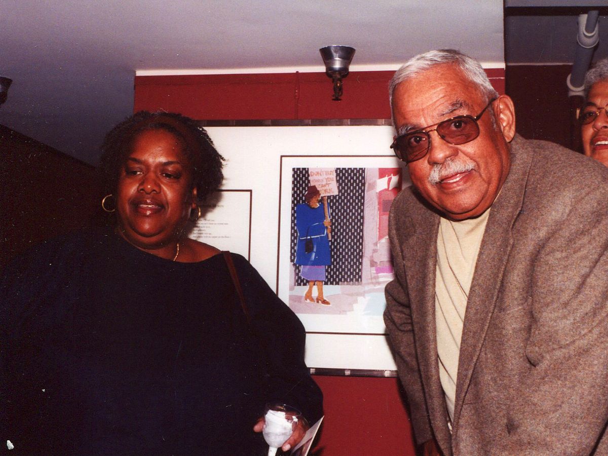 A man and woman standing next to each other.