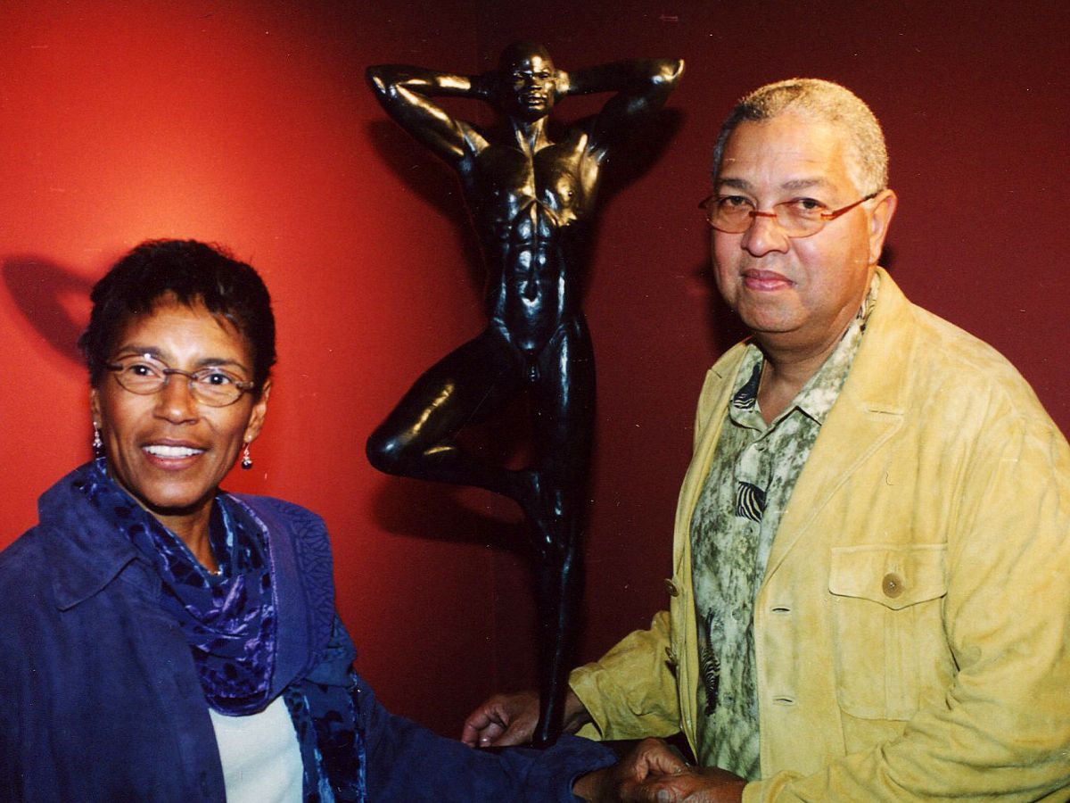 A man and woman standing next to each other.
