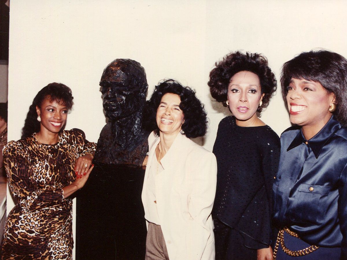A group of women standing next to each other.