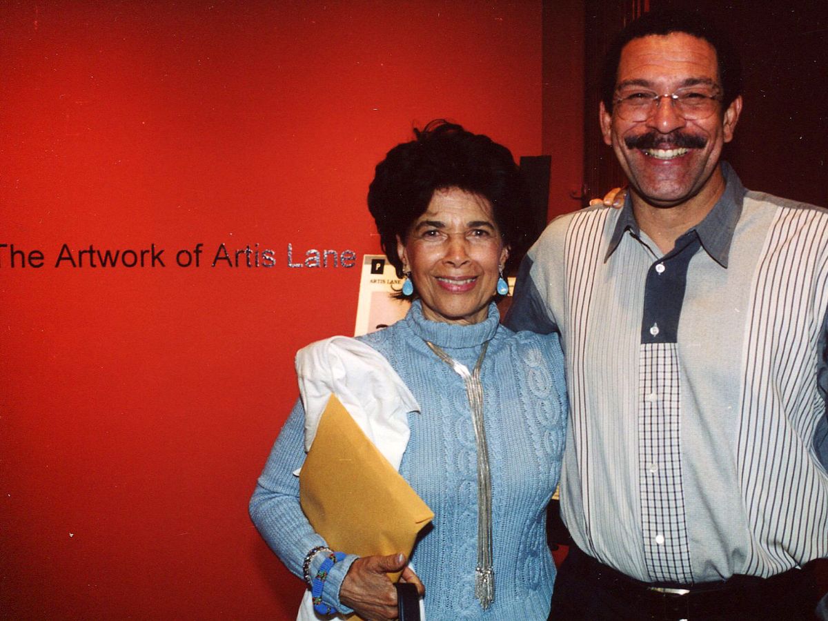 A man and woman standing next to each other.
